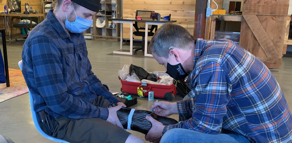 Agile Ortho Employee creating prosthetic leg for man